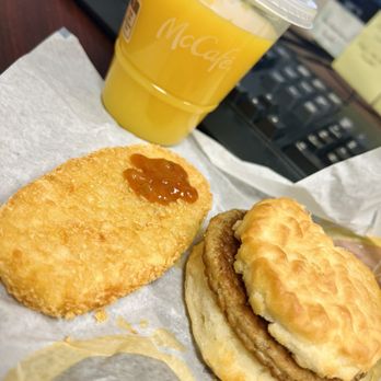 McDonald's - To-go: Sausage biscuit, hash brown with picante and OJ - Burgers Near Me - Houston, Texas