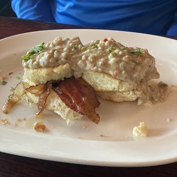 Marlow's Tavern - Brunch Sausage and gravy biscuit with two fried eggs - New American Near Me - Oviedo, Florida Marlow's Tavern - Brunch Sausage and gravy biscuit with two fried eggs - New American Near Me - Oviedo, Florida