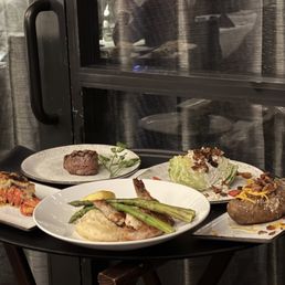 Lobster tail, wedge salad, baked potato, filet mignon Lobster tail, wedge salad, baked potato, filet mignon