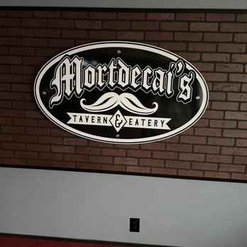 Mortdecai’s Tavern & Eatery - Bar, Side sedation, Logo and some foods. - Cocktail Bars Near Me - Wichita, Kansas Mortdecai’s Tavern & Eatery - Bar, Side sedation, Logo and some foods. - Cocktail Bars Near Me - Wichita, Kansas