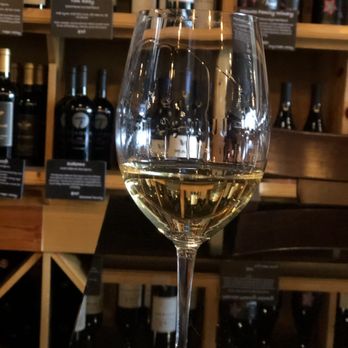 cellar twenty four - a glass of white wine - Wine Bars Near Me - The Woodlands, Texas