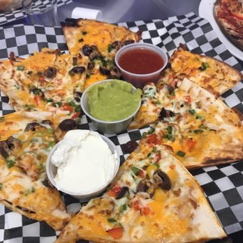 Über Cafbar - a pizza with several toppings - Bars Near Me - Montreal, Quebec Über Cafbar - a pizza with several toppings - Bars Near Me - Montreal, Quebec