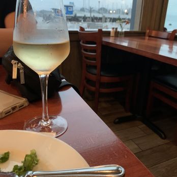 Rockfish Harbor Grill - Cold glass of Chardonnay- with this amazing view! - Seafood Near Me - Monterey, California Rockfish Harbor Grill - Cold glass of Chardonnay- with this amazing view! - Seafood Near Me - Monterey, California