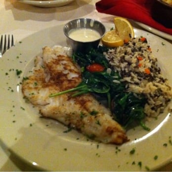 Woolley’s Kitchen & Bar - Walleye served wtih spinach and wild rice - Steakhouses Near Me - Bloomington, Minnesota Woolley’s Kitchen & Bar - Walleye served wtih spinach and wild rice - Steakhouses Near Me - Bloomington, Minnesota