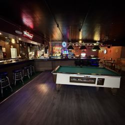 Hans's Place - Pool table & lottery tickets
