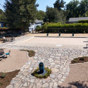 TCT Landscaping - (Tan cover over dark bottom pool.) Fountain with rock base and ornamental grass surround, plants installed in beds... - Landscape Architects or Designers Near Me - Buellton, California TCT Landscaping - (Tan cover over dark bottom pool.) Fountain with rock base and ornamental grass surround, plants installed in beds... - Landscape Architects or Designers Near Me - Buellton, California