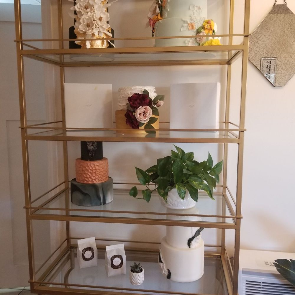 Lush Cakes - a gold shelf with a potted plant - Bakeries Near Me - Waseca, Minnesota Lush Cakes - a gold shelf with a potted plant - Bakeries Near Me - Waseca, Minnesota
