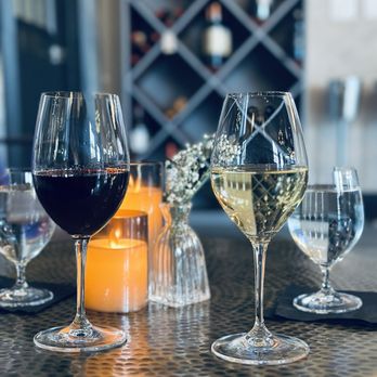 Vine Memorial - wine glasses and candles on a table - Wine Bars Near Me - Houston, Texas Vine Memorial - wine glasses and candles on a table - Wine Bars Near Me - Houston, Texas