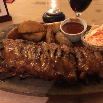 Rib House - That's a regular portion of spare ribs. It's huge! - Steakhouses Near Me - Roskilde, 85 Rib House - That's a regular portion of spare ribs. It's huge! - Steakhouses Near Me - Roskilde, 85