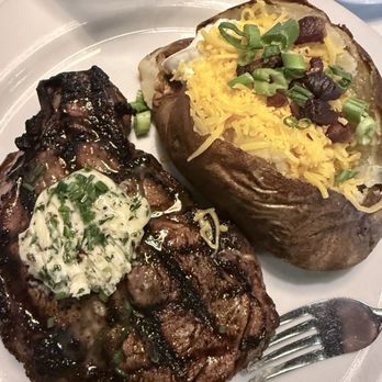 All Steak Restaurant - Ribeye with loaded baked potato. Cooked to perfection. - Bars Near Me - Cullman, Alabama All Steak Restaurant - Ribeye with loaded baked potato. Cooked to perfection. - Bars Near Me - Cullman, Alabama