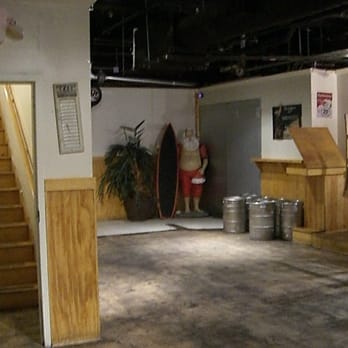 Sand Bar - a man standing in the middle of the room - Bars Near Me - Athens, Georgia