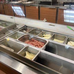 a buffet with a variety of food items a buffet with a variety of food items