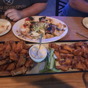 Knuckles Knockout Grill - a plate of chicken wings and a platter of wings - Sports Bars Near Me - Rochester, New York Knuckles Knockout Grill - a plate of chicken wings and a platter of wings - Sports Bars Near Me - Rochester, New York