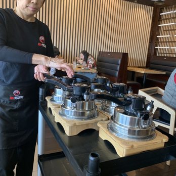 88 Tofu - a woman preparing food in a restaurant - Korean Near Me - Duluth, Georgia