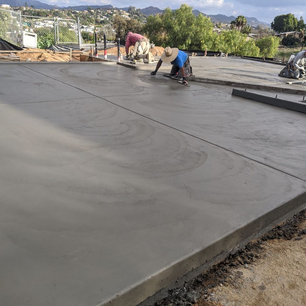 Minez Concrete - Finishers at work shortly after pour. - Masonry/Concrete Near Me