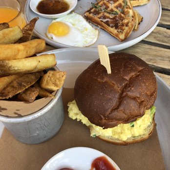 Evelina - Duck and waffles with a sunny side up egg, salmon and egg sandwich. - Italian Near Me - Brooklyn, New York