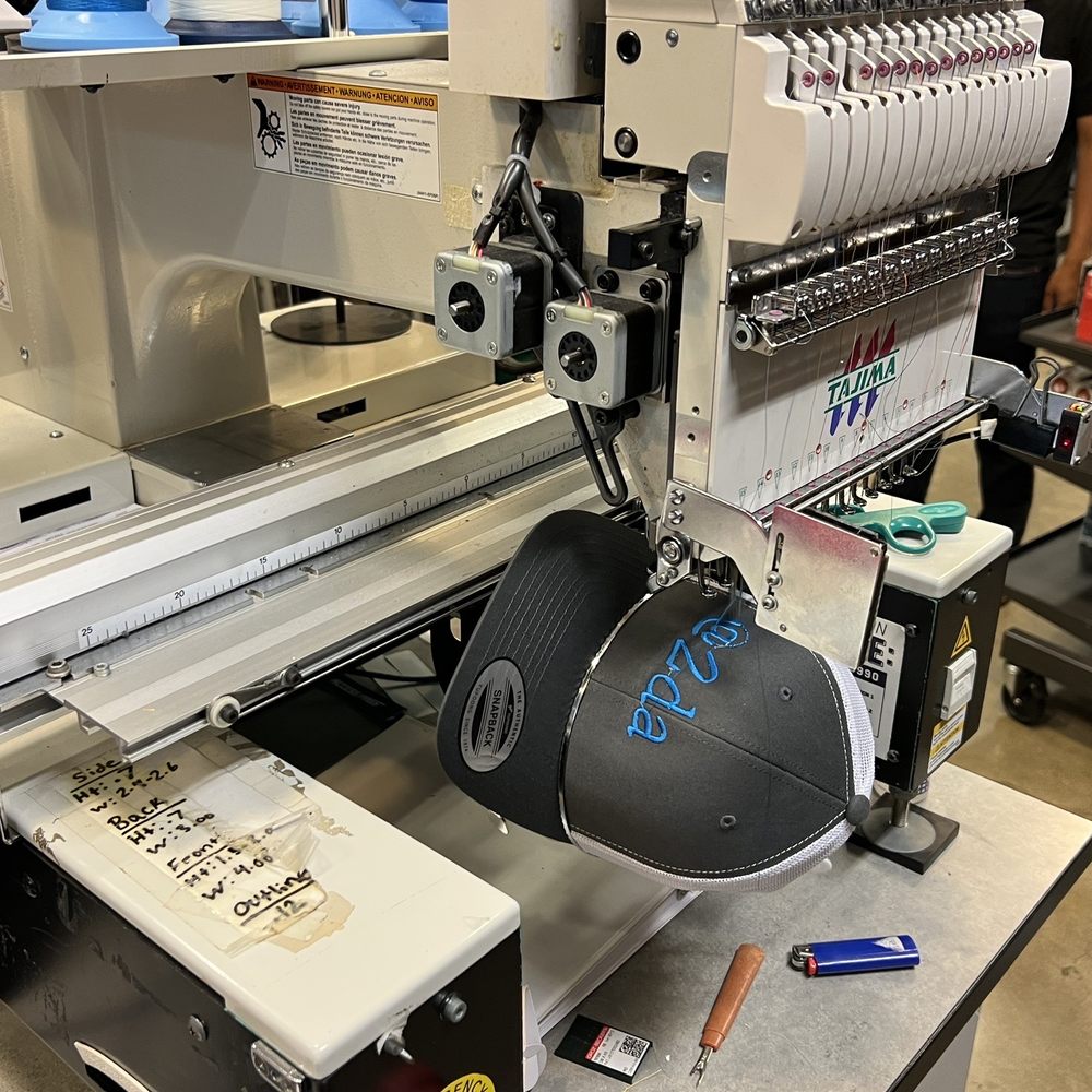 Lids - The machine in action! - Sports Wear Near Me - National City, California