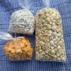 Clary's Gourmet Popcorn - Top left - White cheddar. Bottom left - jalapeños cheddar and on the right is the kettle corn