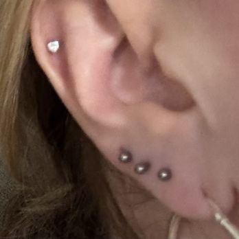 The Plastic Flamingo - 2 lobe stretches, 1 lobe piercing, and 1 helix piercing. - Tattoo Near Me - Daytona Beach, Florida