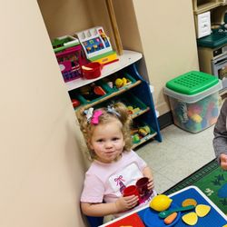 Purple Dragon Day Care - My daughter loving all the toys! Kitchen is her favorite. They keep the place really clean!