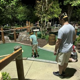 Mini golf course with dad and brother Mini golf course with dad and brother