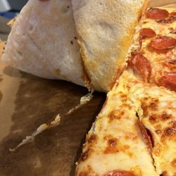 Village Pizza - Raw undercooked pepperoni pizza