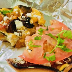 K-Kar - Veggie breakfast sandwich with sautéed mushrooms and peppers and tomato and cream cheese served open face on a toasted bagel