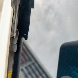 Mournings of both sides of front window were cut to remove broken the window and left unfixed.