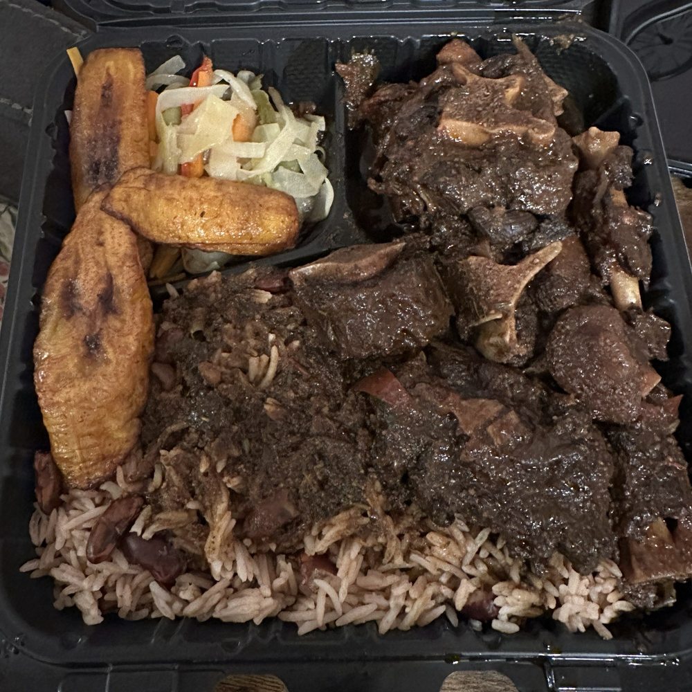 Lindo Caribbean Kitchen - Oxtails with rice and peas and cabbage. - Caribbean Near Me - Baltimore, Maryland Lindo Caribbean Kitchen - Oxtails with rice and peas and cabbage. - Caribbean Near Me - Baltimore, Maryland