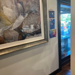 a painting of a bird on display