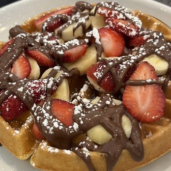 Eggsquisite Cafe - Allen - Nutella waffle  Sliced Strawberries - Breakfast & Brunch Near Me - Allen, Texas