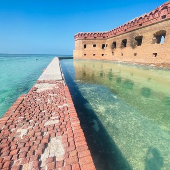 Key West Seaplane Adventures - Moat wall extends part way around both directions. - Tours Near Me - Key West, Florida Key West Seaplane Adventures - Moat wall extends part way around both directions. - Tours Near Me - Key West, Florida