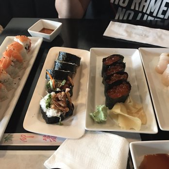 Kuru Kuru Sushi - Another plate of ikura and rolls (I can't remember the name) - Sushi Bars Near Me - Burbank, California Kuru Kuru Sushi - Another plate of ikura and rolls (I can't remember the name) - Sushi Bars Near Me - Burbank, California