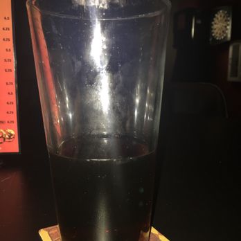 Houston's Lounge - a drink in a glass on a coaster - Lounges Near Me - La Vista, Nebraska Houston's Lounge - a drink in a glass on a coaster - Lounges Near Me - La Vista, Nebraska