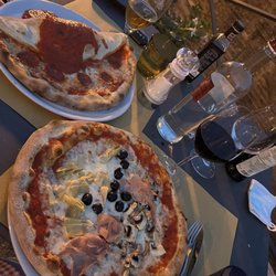 Pizzeria di Nonno Mede - Two pizzas -- Quattro Stagionne and the Mezze (half calzone, half pizza). Terrifyingly, we ate all but one slice!!!