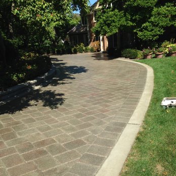 Grassroots Landscape Specialties - For this large drive our crews treated the concrete ribbon separate from the brick pavers, this insured each material was properly protected - Landscaping Near Me - Roselle, Illinois