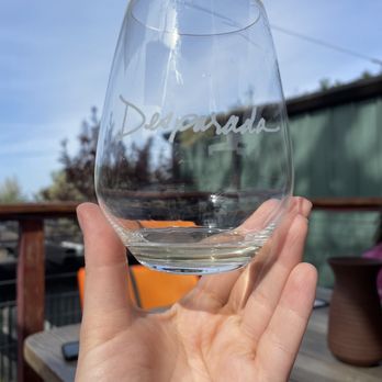 Desparada Wines - a hand holding a wine glass - Wineries Near Me - Paso Robles, California Desparada Wines - a hand holding a wine glass - Wineries Near Me - Paso Robles, California