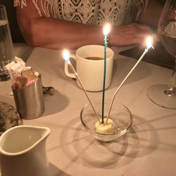 Maple & Ash - This slice of banana and 3 sparklers were compliments of M&A for our anniversary. - Steakhouses Near Me - Chicago, Illinois