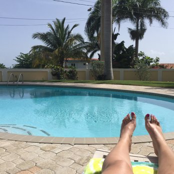 Villa El Encanto - Pool side relaxing soaking up some Vitamin D. - Vacation Rentals Near Me - Rincon, Puerto Rico