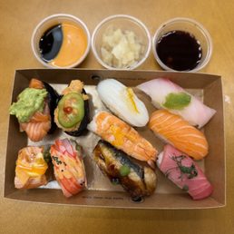 0.75lb Sushi by the Pound (~$18) with eel sauce, spicy mayo, ginger, soy sauce & wasabi 0.75lb Sushi by the Pound (~$18) with eel sauce, spicy mayo, ginger, soy sauce & wasabi