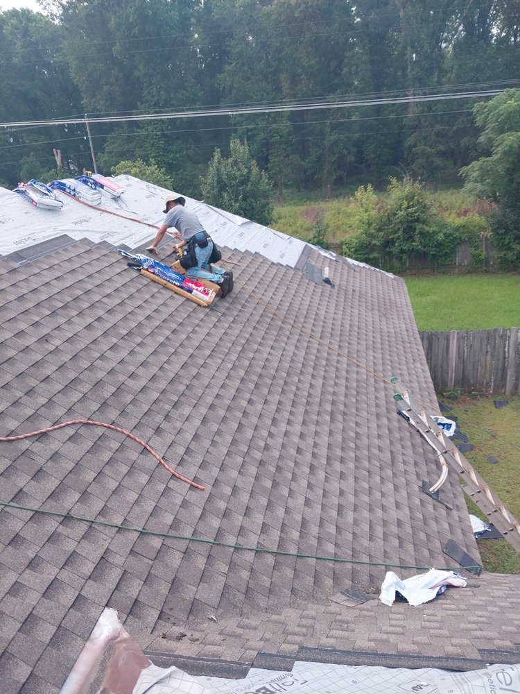 Slide of Tyndal Roofing