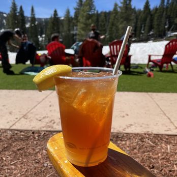 Backyard Bar & BBQ - Hannah Teater cocktail out on the Adirondack chairs - Barbeque Near Me - Truckee, California
