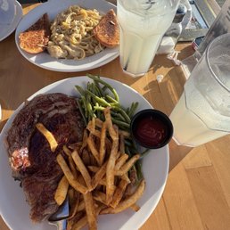 Ribeye steak with fries & green beans and the chicken Alfredo