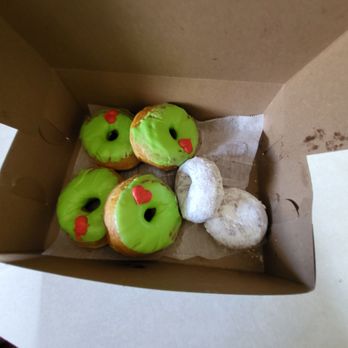 Sandy's Donut House - Grinch donuts and powder donuts. Two more were not pictured because I ate them - Donuts Near Me - Grand Rapids, Michigan
