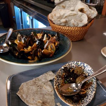 Servia - Half eaten olives and mussels - Mediterranean Near Me - Boston, Massachusetts