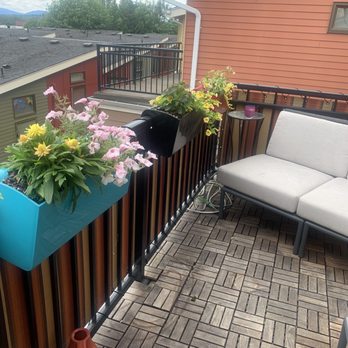 Gardeninggaga! - a patio with a couch and flower boxes - Landscaping Near Me - Seattle, Washington Gardeninggaga! - a patio with a couch and flower boxes - Landscaping Near Me - Seattle, Washington