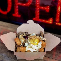 Persephonē on Wheels - Special: Greek TaterTot Poutine. With Gyro meat, skordalia, potato gravy, feta, Kalamata olives, fried garlic & sunny egg.