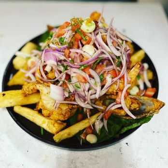 Brasas Fusion - a plate of fries and vegetables - Latin American Near Me - New York, New York Brasas Fusion - a plate of fries and vegetables - Latin American Near Me - New York, New York