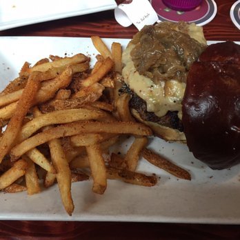 The Bad Apple - GRIZZLY ADAMS (braised short rib, an ale, stone ground mustard, onion jalapeño & white cheddar sauce, caramelized onion on a pretzel bun) - Burgers Near Me - Chicago, Illinois
