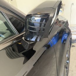 Mirror panel broken and turned inside out.